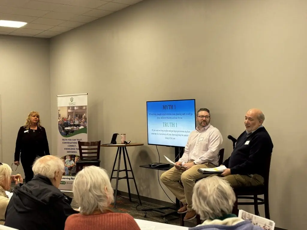 moderators leading a seminar on education for older adults
