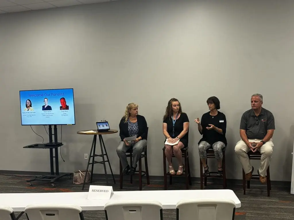 Panelist speak at a free senior citizen seminar in Southern Maine