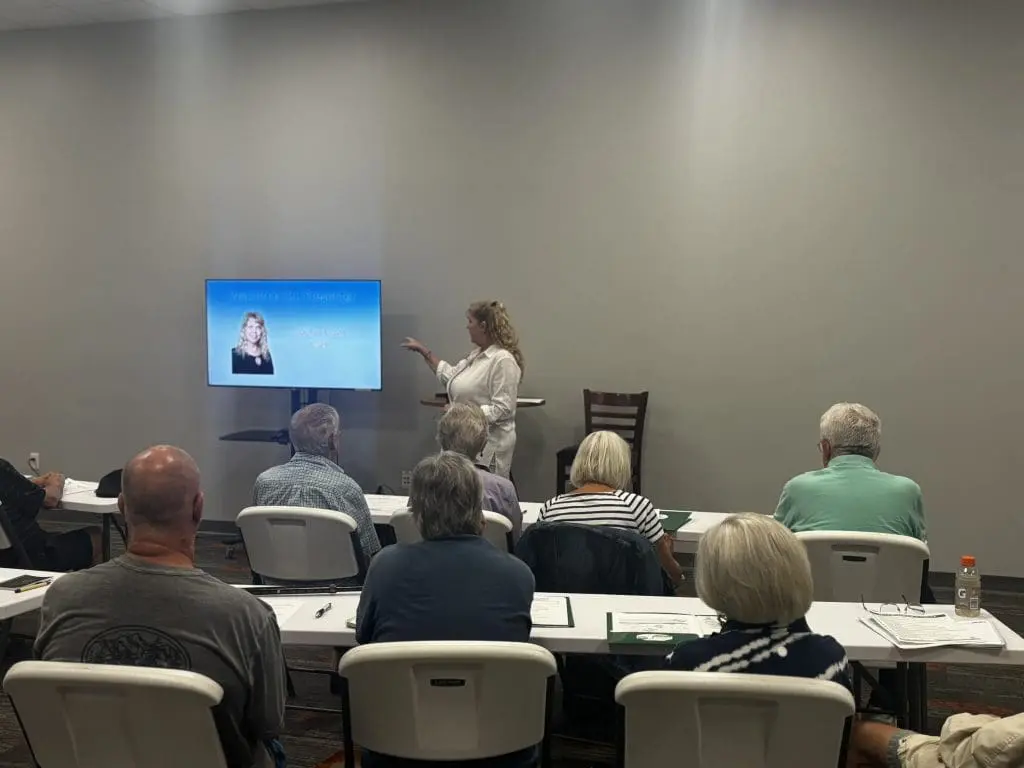 woman teaches class in Portland Maine about home ownership as a senior