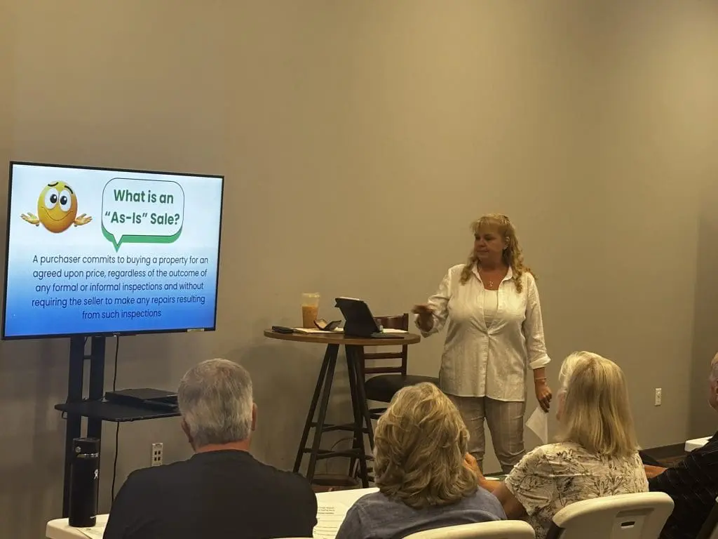woman teaches class for older adults about home ownership